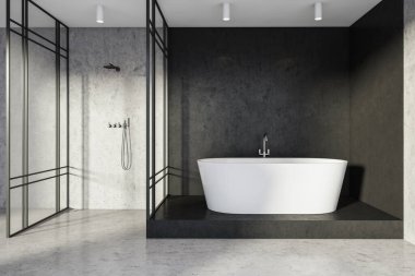 Kübik banyo alanındaki beyaz küvetin içinde siyah taş döşeme ve cam bölmeli gri duş odasının yanındaki duvarlar var. Minimalist modern ev tasarımı kavramı. 3d oluşturma