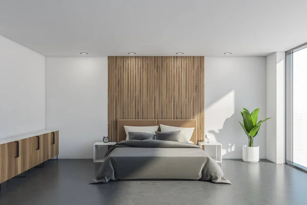 Interior with bed, sideboard, white walls, side tables and ceiling, wooden details, indoor plant, grey concrete flooring and panoramic view. 3d rendering
