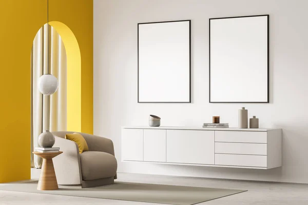 Light interior with two framed posters, shelf, armchair, lamp, coffee table, rug, concrete floor, yellow arch and curtains on the background. Concept of a modern house design. Mock up. 3d rendering