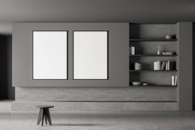 Minimalist oturma odasının iç kısmında, moda taburesi ve gri kitaplığı olan iki adet boş afiş. Beton döşeme. Modern ev tasarımı kavramı. 3d oluşturma