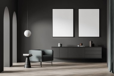 İçinde koyu gri duvarlar, kemerler, raf, yeşil koltuk, beyaz kolye lambası, kahve masası ve parke zeminde iki adet boş model poster var. Modern ev tasarımı kavramı. 3d oluşturma