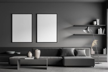 Oturma odasının içinde gri renkli iki çerçeveli pankart. Kanepe, beton zemin, modern minimalist raflar, ince lamba ve sehpa. Model yap. 3d oluşturma