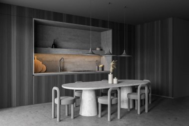 Koyu gri mutfak alanının köşesi, aydınlatma yeri, tekstil tabureli oval masa, beton zemin ve üç kolye lambası. Modern ev tasarımı kavramı. 3d oluşturma