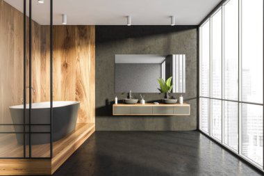 Interior with bathtub, partition, panoramic view, mirror with shelf beneath and two sinks. Dark grey and wood alike materials of walls and floor. Concept of a modern house design. 3d rendering