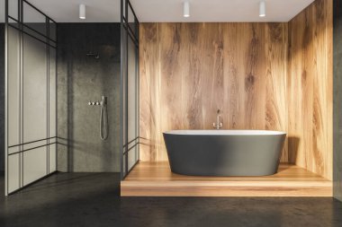 Interior with black bathtub, wood alike and black stone materials for walls and floor, glass shower cabin and white ceiling with lights. Concept of a minimalist modern house design. 3d rendering
