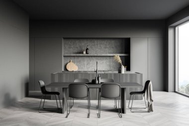 İçi yemek masası, altı sandalye, parke zemin, elektrikli fırın ve kırsal manzaralı panoramik pencere ile kaplı koyu renk bir mutfak odası. Çağdaş minimalist tasarım. 3d oluşturma