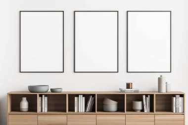 Oturma odasının iç kısmında, ışık duvarı ve trend ahşap büfede dizaynınız için üç adet siyah çerçeveli poster. Modern minimalist ev kavramı. 3d oluşturma