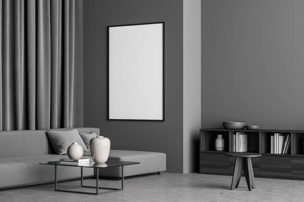 Empty poster on the wall of the minimalist dark grey living room with sofa, coffee table, stool and sideboard. Concrete floor. A concept of modern house design. Mockup. 3d rendering