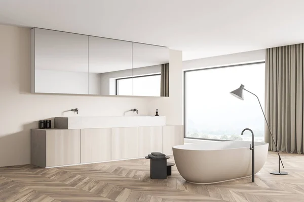 Beige and white bathroom interior design with a panoramic view, a partition, a trendy bathtub with a thin lamp, a sink with two faucets, a vanity and a mirror. Parquet floor. 3d rendering