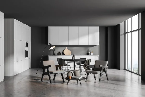 座位区域有两张扶手椅 圆形餐桌 白色橱柜 全景和混凝土地面绑在简约的灰色厨房内部 现代室内设计的概念 3D渲染 — 图库照片