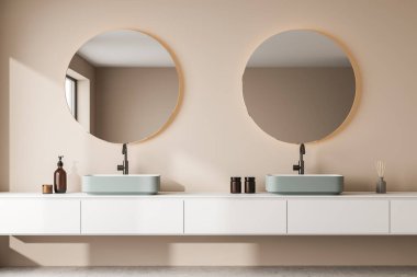 Yeşil yüzen lavaboları ve modern bej banyo iç dekorasyonunda aydınlatma olan iki yuvarlak aynası olan bir raf görüntüsü. Minimalist bir kavram. 3d oluşturma