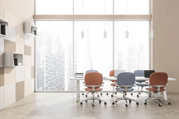 Meeting room with blue and terracotta office chairs, pendant lights, a panoramic view, a concrete floor, white and beige tile wall and ledge shelves. A concept of modern office design. 3d rendering