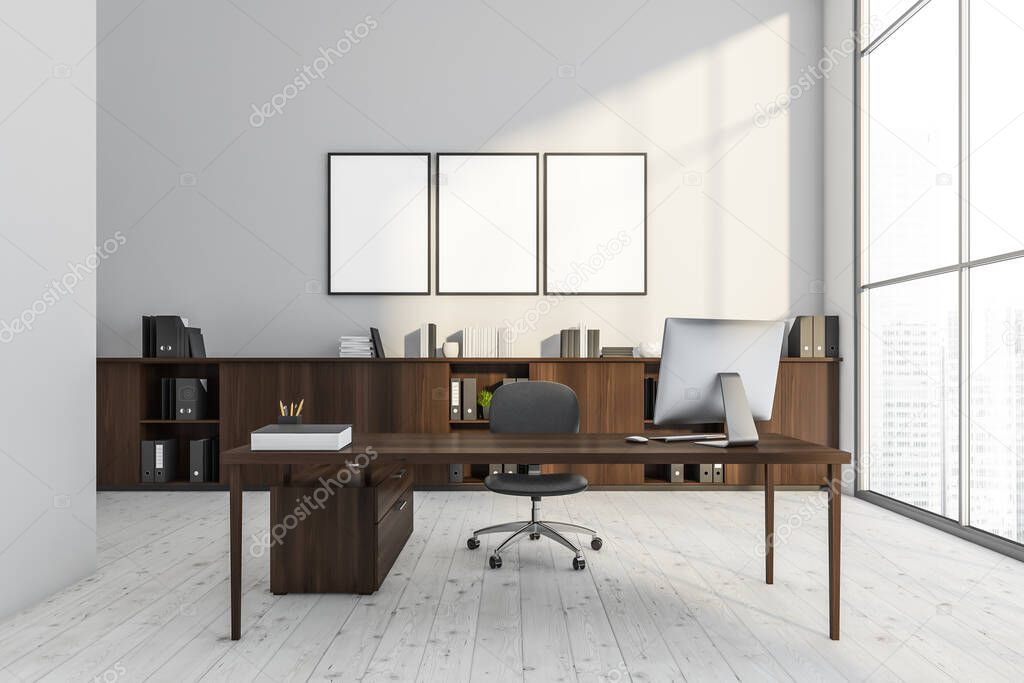 Three empty posters in the white office interior with a dark wood desk with an office chair and a sideboard. Light wood flooring. Mock up. A concept of modern panoramic building design. 3d rendering