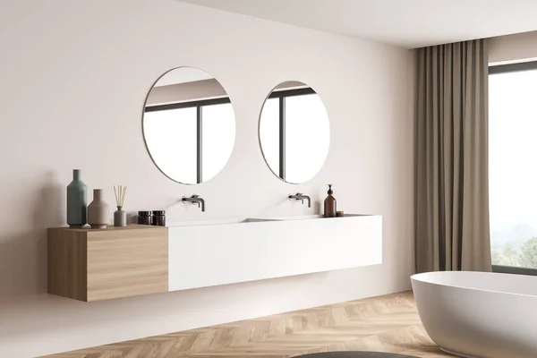 Corner view of a beige bathroom interior with a panoramic view, trendy details of the modern vanity, a white ceramic bath and parquet flooring. Minimalist design. 3d rendering
