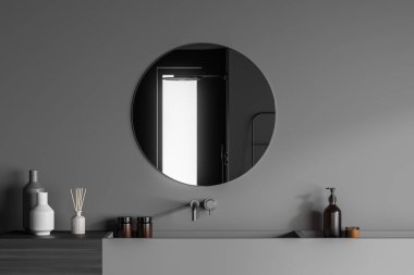 Lavabonun üstündeki gri duvarda yuvarlak aynası olan şık bir banyo süsü. Tahta ve seramik malzemeler. Modern ev iç tasarımı kavramı. 3d oluşturma