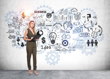Businesswoman in green dress standing near colourful sketch with light bulb, business, plan, teamwork, cloud data, cogwheel on concrete wall. Concept of imagination and inspiration for creative idea clipart