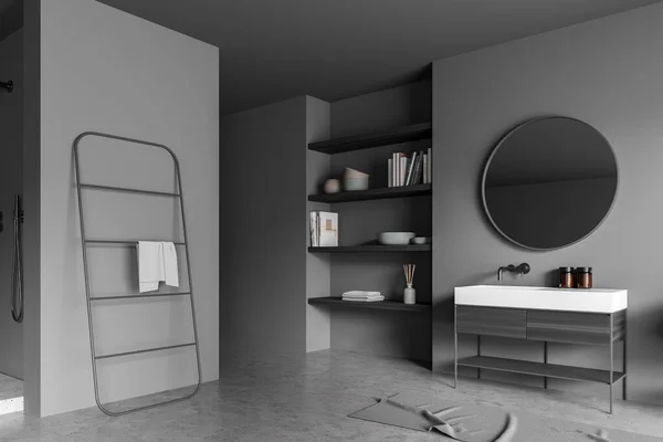 黑暗的灰色淋浴房的角落 内部有一个圆形的镜子在时髦的水池区 一个特殊的架子 一个纤细的毛巾架和混凝土地板 现代室内设计的概念 3D渲染 — 图库照片