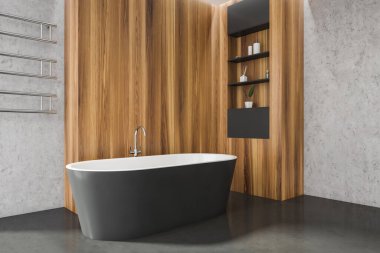 Banyo içinin köşesinde ahşap gardırop, açık raflar, zarif bir havlu asacağı ve beton zeminde oval koyu gri bir küvet var. Modern apartman tasarımı kavramı. 3d Kırpma