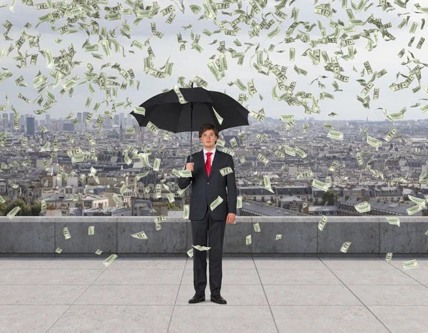 Businessman and falling dollar — Stock Photo, Image