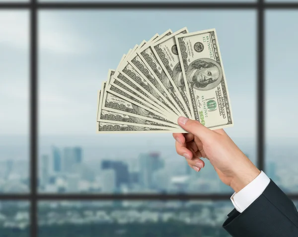 Hand stretches money — Stock Photo, Image