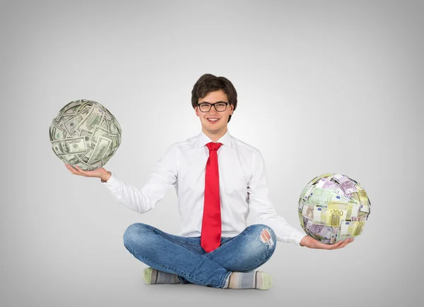 Businessman holding money balls — Stock Photo, Image