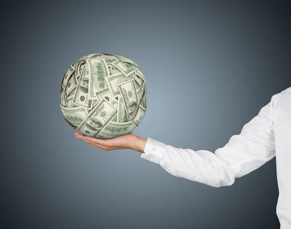 Hand holding money ball — Stock Photo, Image