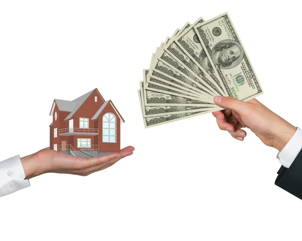 Hand giving money for housing — Stock Photo, Image