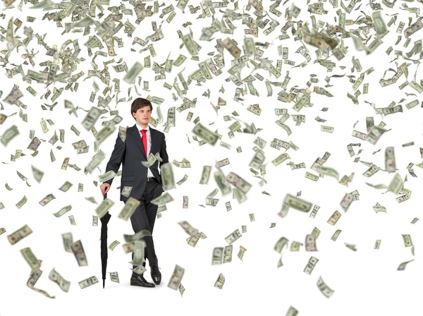 Businessman and falling dollar bills — Stock Photo, Image