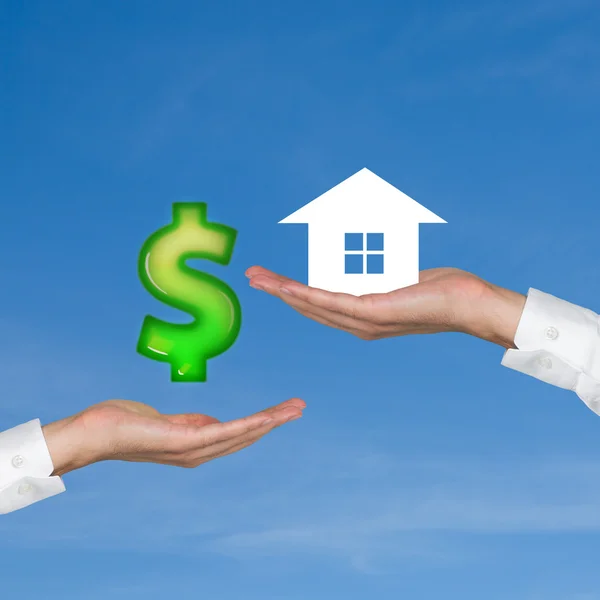 Hand giving dollar for housing — Stock Photo, Image