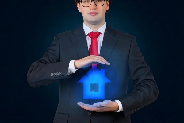 Businessman holding house — Stock Photo, Image