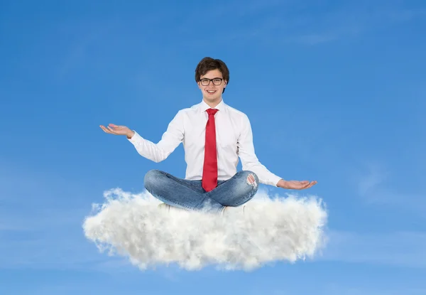 Businessman sitting on cloud — Stock Photo, Image