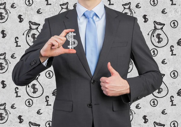 Biznesmen posiadający pieniądze symbol — Zdjęcie stockowe