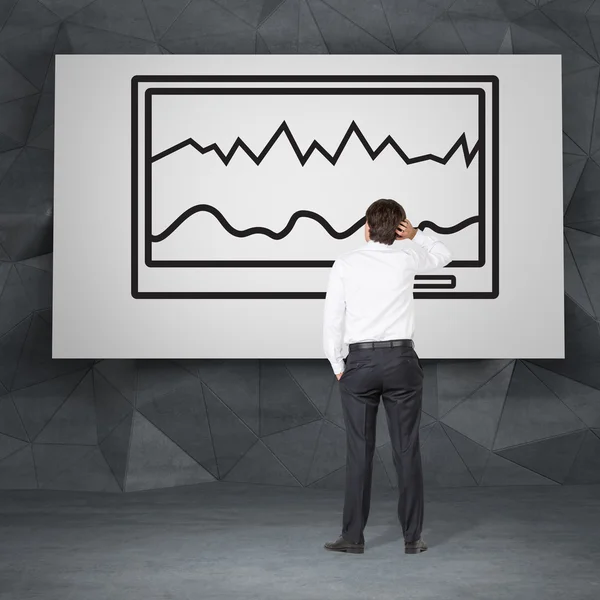 Man looking to chart — Stock Photo, Image