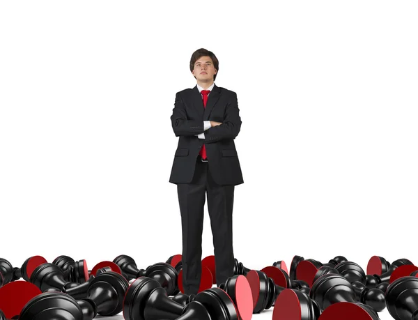 Businessman and falling pawns — Stock Photo, Image