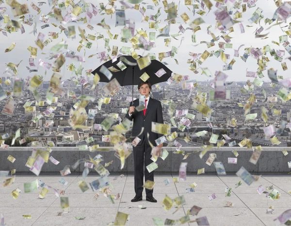 Businessman and falling euro bills — Stock Photo, Image