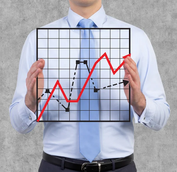 Businessman holding graph — Stock Photo, Image