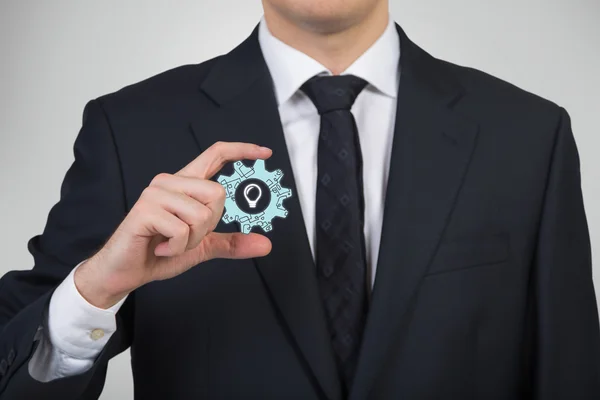 Cogwheel with lamp — Stock Photo, Image