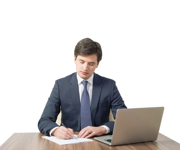 Young businessman signs document — Stock Photo, Image