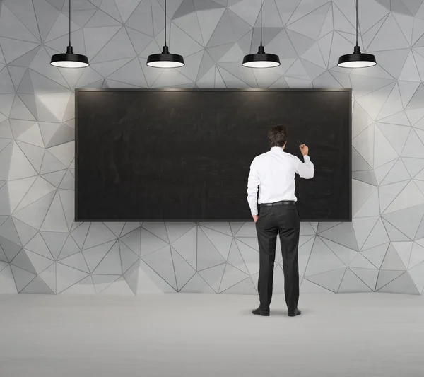 Man drawing on blackboard — Stock Photo, Image