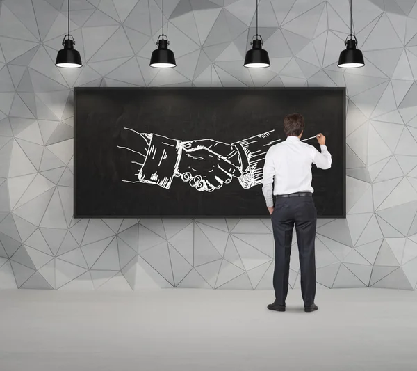 Businessman drawing handshake — Stock Photo, Image