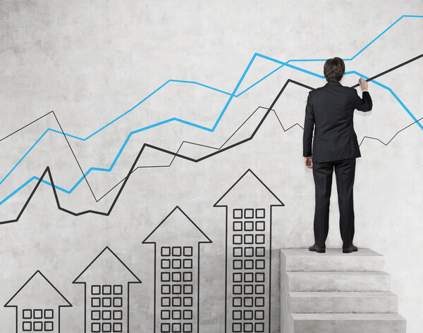 businessman drawing chart