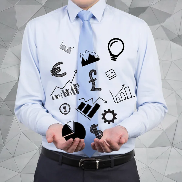 Businessman holding business icons — Stock Photo, Image