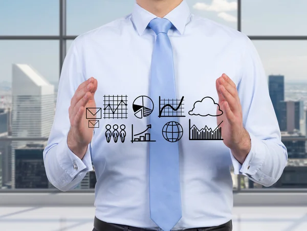 Businessman holding graphs — Stock Photo, Image