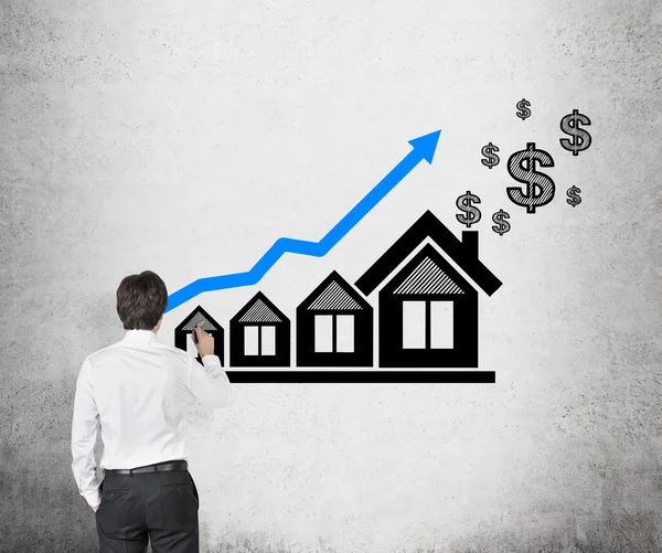 Man drawing chart and house — Stock Photo, Image