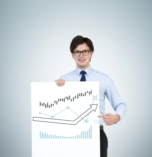 Muž hospodářství plakát s šipkami — Stock fotografie