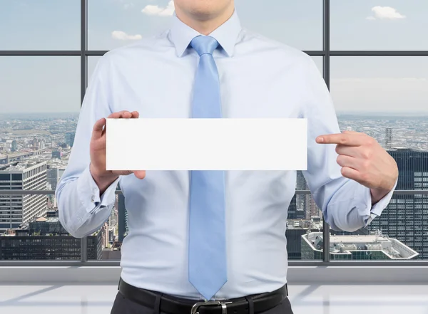 Businessman holding placard — Stock Photo, Image