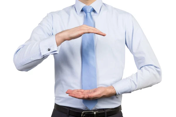 Businessman holding invisible objects — Stock Photo, Image