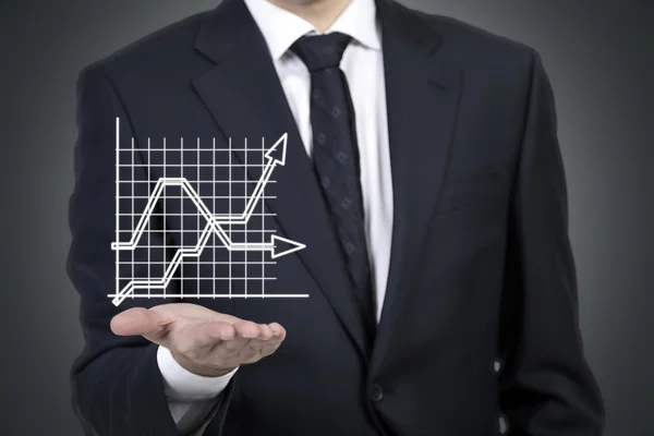 Businessman holding graph — Stock Photo, Image