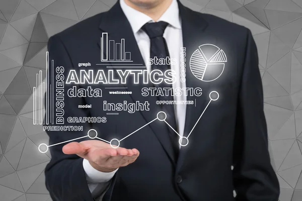 Businessman holding analytics — Stock Photo, Image