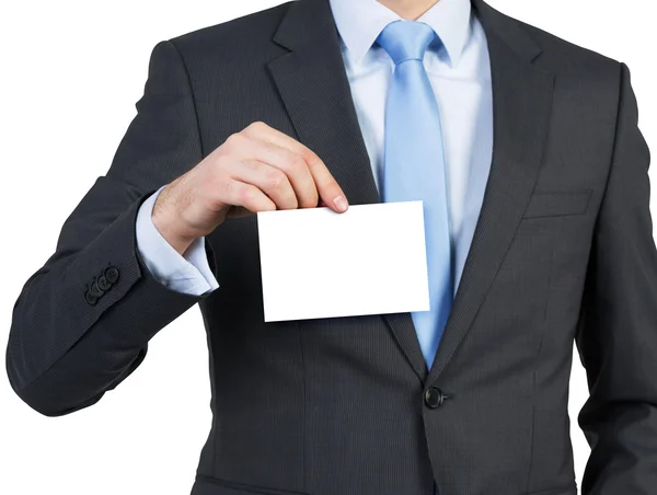 Biznesmen trzymający pusty papier — Zdjęcie stockowe